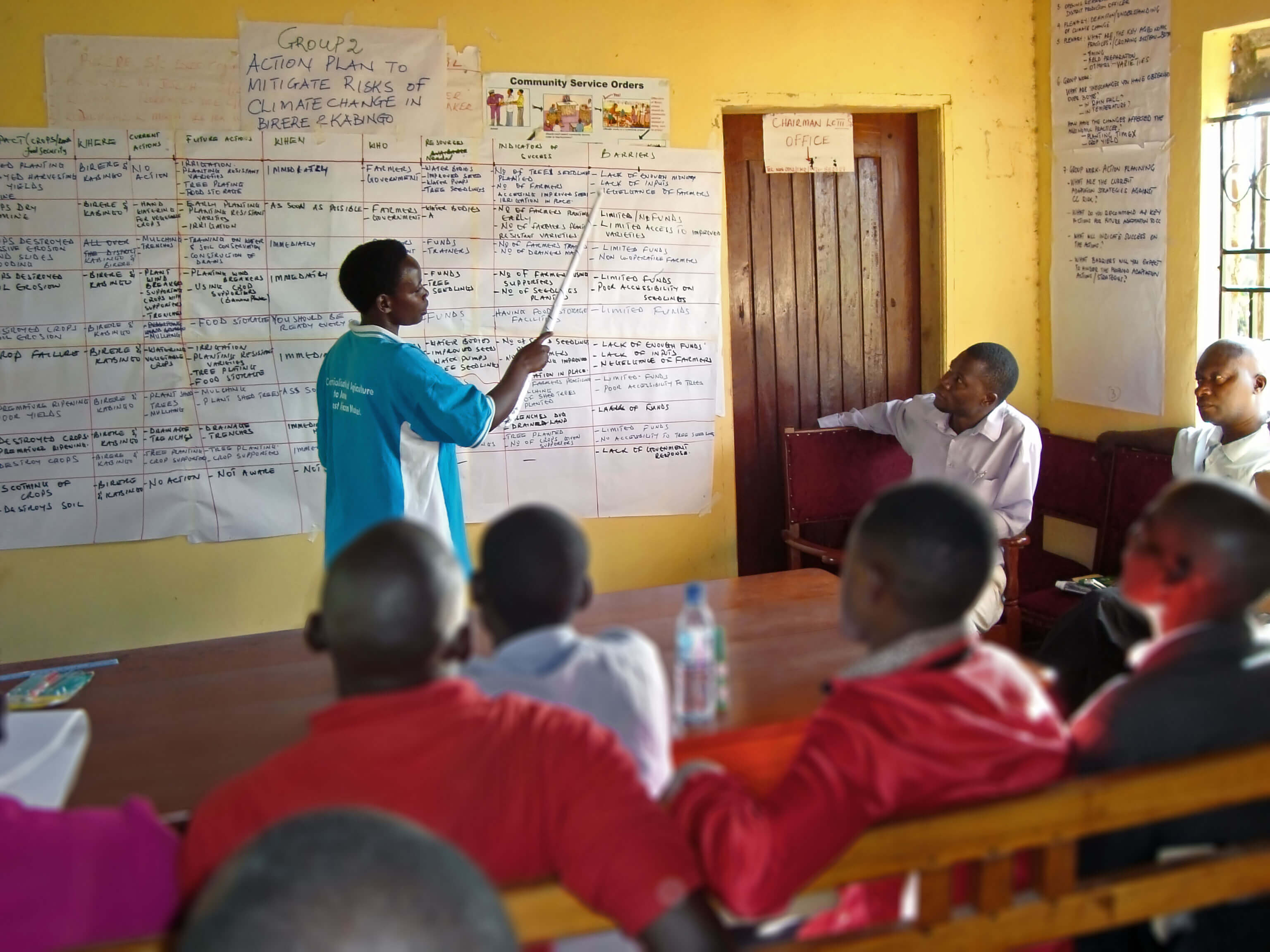 Participant presenting a community action plan in Uganda